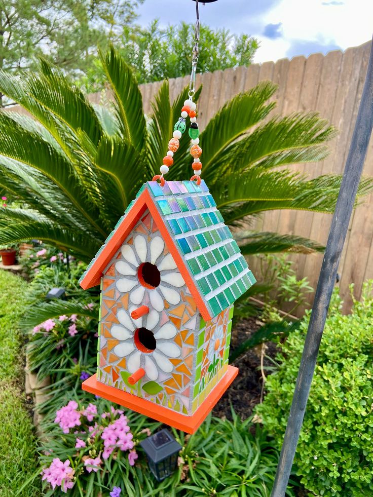 floral orange and teal birdhouse mosaic