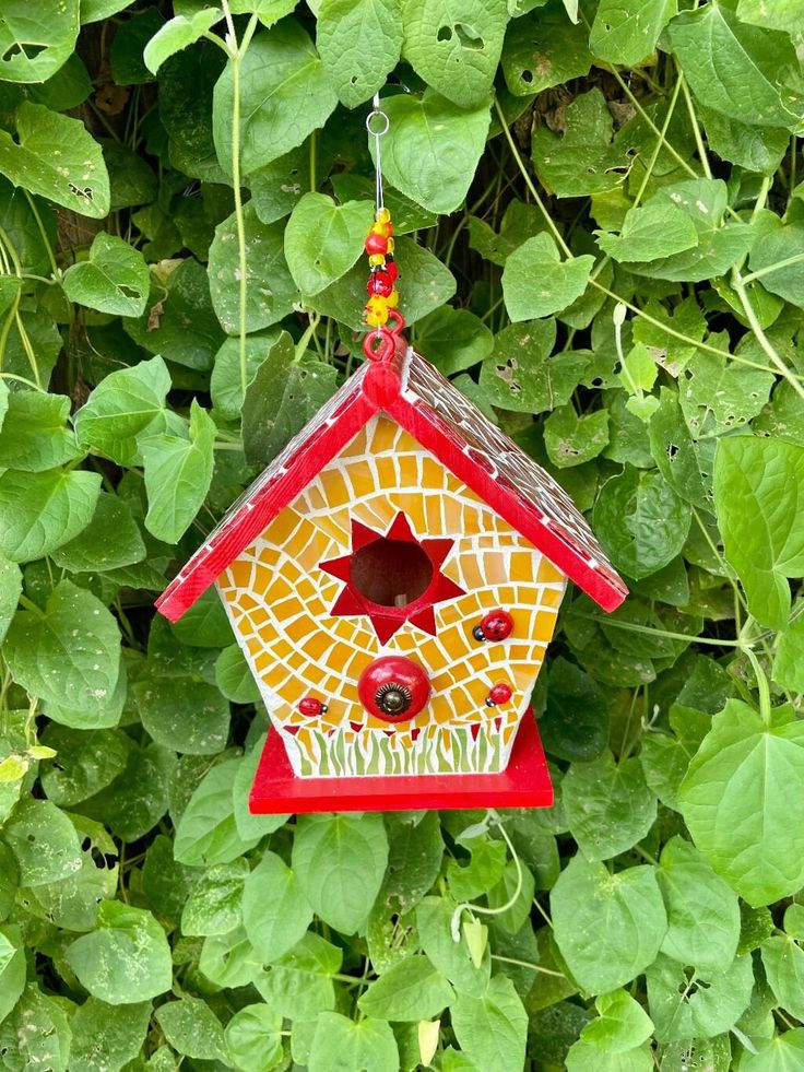 cute red and yellow mosaic birdhouse